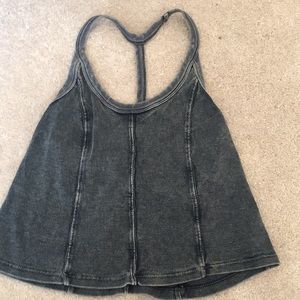 Black open back tank top. Cropped.